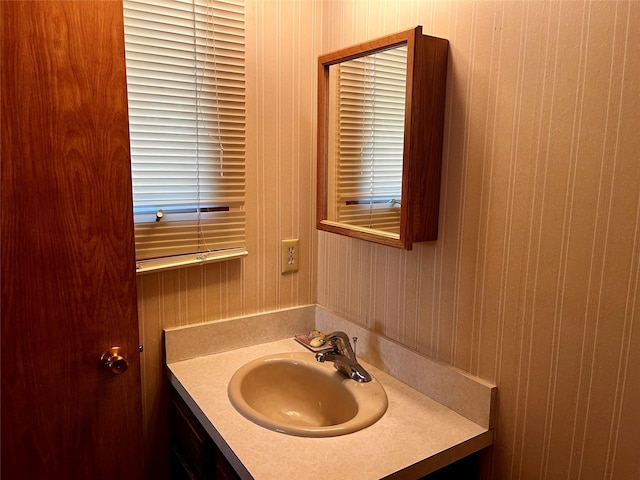 1114 Creek Crossing Rd, Missoula, MT 59802 - bathroom with vanity and wood walls