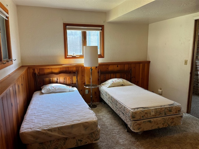 1114 Creek Crossing Rd, Missoula, MT 59802 - bedroom with carpet, wainscoting, and wood walls