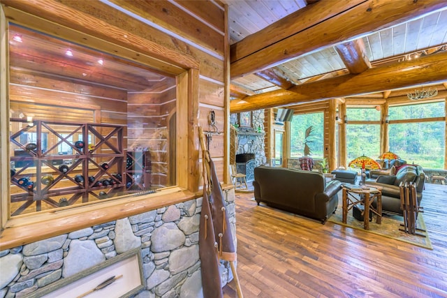 6900 Nez Perce Rd, Darby, MT 59829 - living area featuring hardwood / wood-style flooring, wooden walls, and wooden ceiling with exposed beams