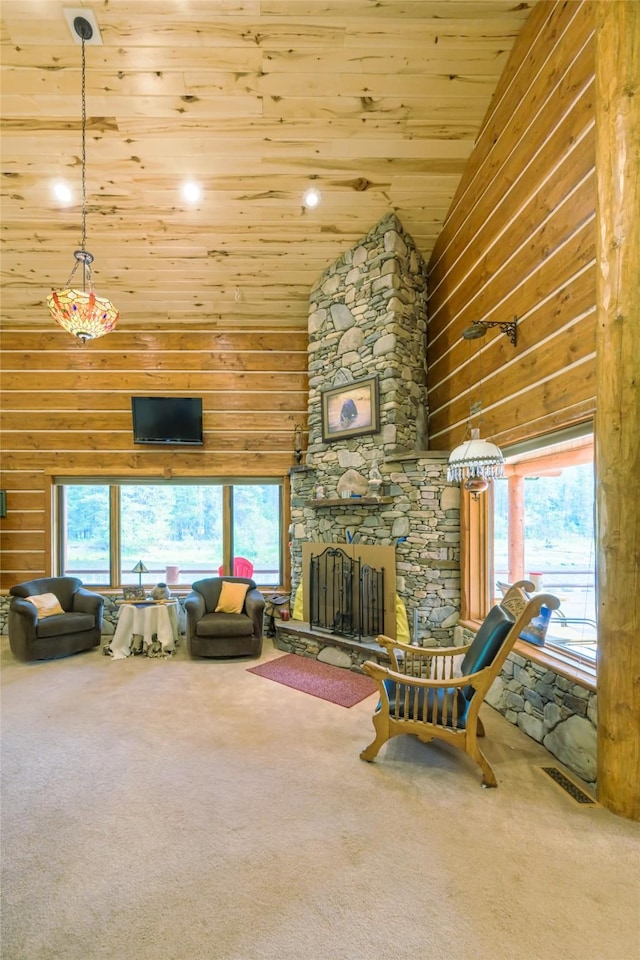 6900 Nez Perce Rd, Darby, MT 59829 - carpeted living room with high vaulted ceiling, a stone fireplace, wooden ceiling, and wooden walls