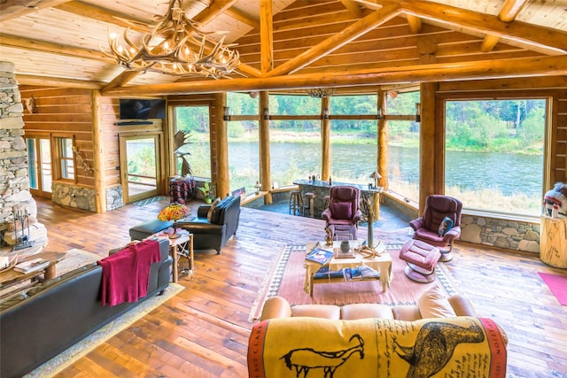 6900 Nez Perce Rd, Darby, MT 59829 - living area with wooden ceiling, a chandelier, hardwood / wood-style floors, and wooden walls