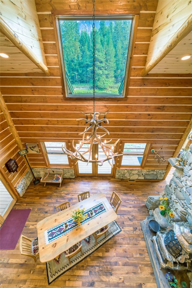 6900 Nez Perce Rd, Darby, MT 59829 - living area with a chandelier, hardwood / wood-style flooring, and wooden walls