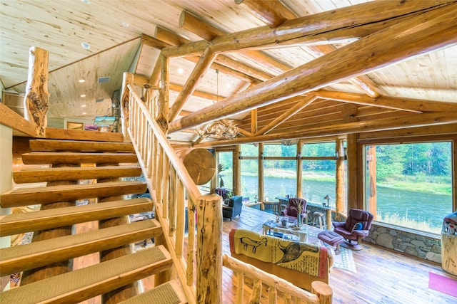 6900 Nez Perce Rd, Darby, MT 59829 - stairway featuring wooden ceiling, hardwood / wood-style floors, lofted ceiling, and a water view