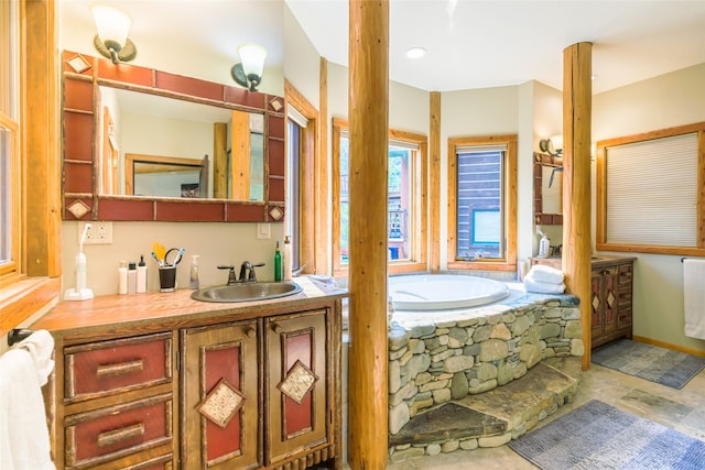 6900 Nez Perce Rd, Darby, MT 59829 - full bath featuring vanity, a garden tub, and stone finish floors