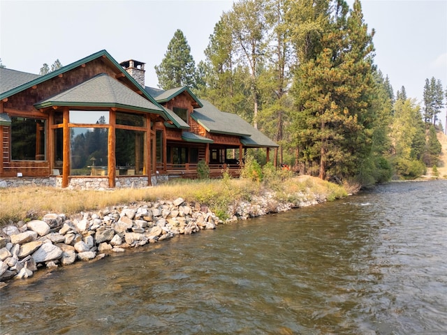 6900 Nez Perce Rd, Darby, MT 59829 - rear view of house featuring a chimney and a water view