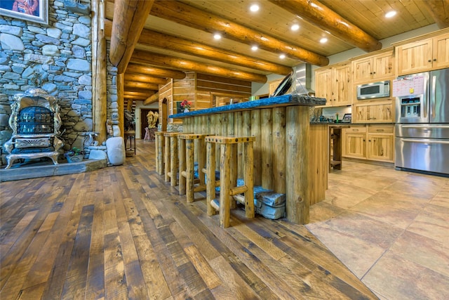 6900 Nez Perce Rd, Darby, MT 59829 - interior space with stainless steel appliances, dark countertops, wooden ceiling with exposed beams, light brown cabinets, and recessed lighting