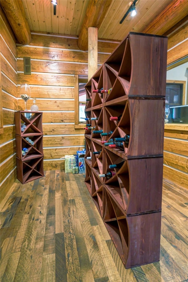 6900 Nez Perce Rd, Darby, MT 59829 - wine cellar with wood ceiling, wood walls, and hardwood / wood-style floors