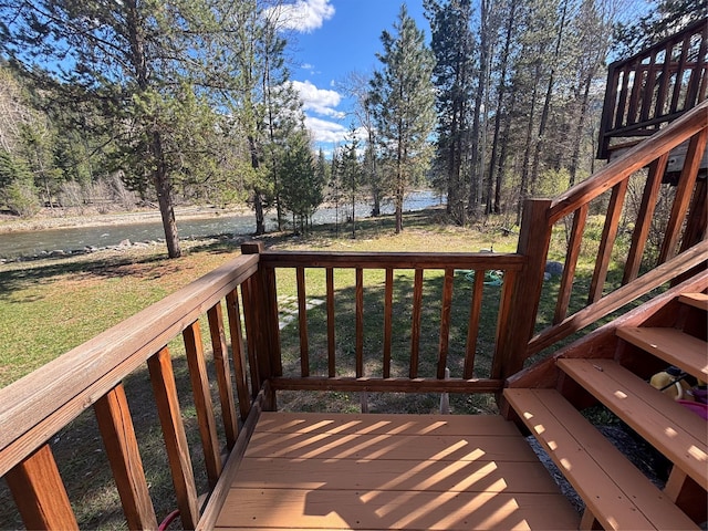 6900 Nez Perce Rd, Darby, MT 59829 - wooden terrace with a water view, a yard, and stairs