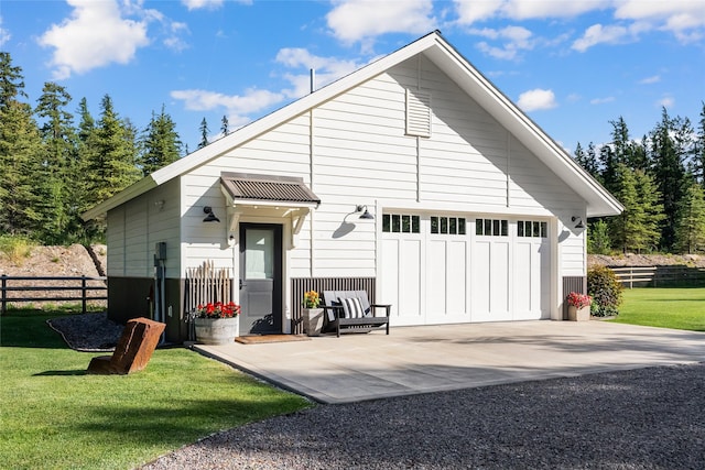14833 Sunburst Dr, Bigfork, MT 59911 - rear view of house featuring a detached garage
