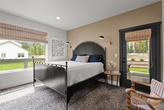 14833 Sunburst Dr, Bigfork, MT 59911 - bedroom with multiple windows, carpet floors, and recessed lighting