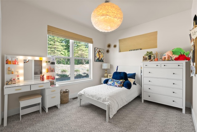 14833 Sunburst Dr, Bigfork, MT 59911 - carpeted bedroom featuring multiple windows and a desk