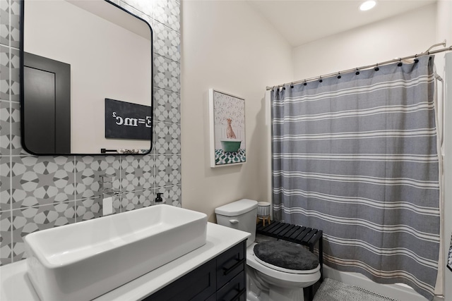 14833 Sunburst Dr, Bigfork, MT 59911 - bathroom with vanity, a shower with shower curtain, decorative backsplash, and recessed lighting