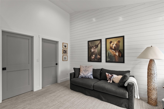 14833 Sunburst Dr, Bigfork, MT 59911 - carpeted living area featuring wood walls and high vaulted ceiling