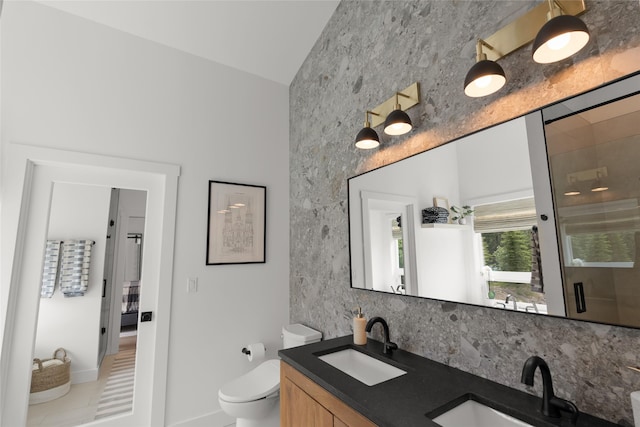 14833 Sunburst Dr, Bigfork, MT 59911 - bathroom featuring double vanity and decorative backsplash