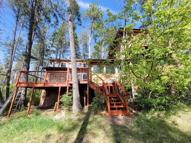 9230 Mt Highway 35, Bigfork, MT 59911 - back of property featuring stairs and a deck