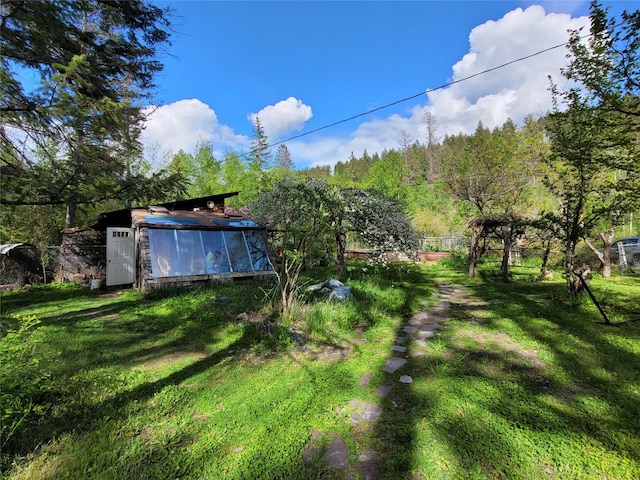 9230 Mt Highway 35, Bigfork, MT 59911 - view of green lawn with an outbuilding