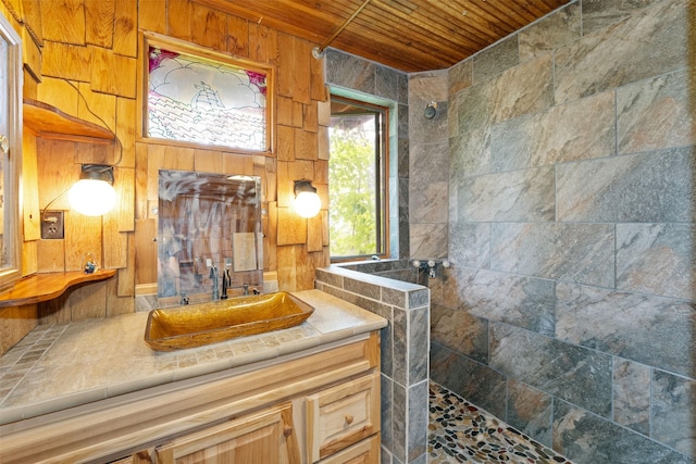 9230 Mt Highway 35, Bigfork, MT 59911 - full bath featuring wooden ceiling, walk in shower, vanity, and wooden walls