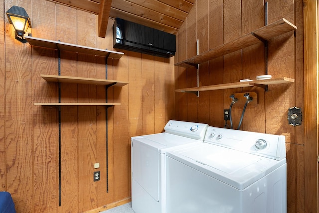 9230 Mt Highway 35, Bigfork, MT 59911 - laundry room featuring separate washer and dryer and wood walls