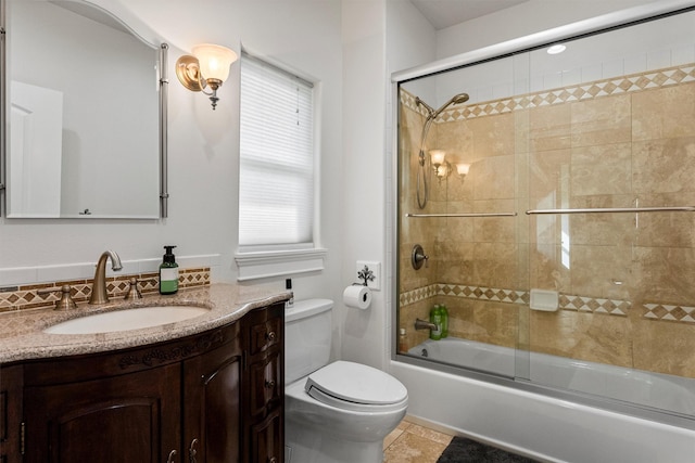 5959 Hayes Creek Rd, Missoula, MT 59804 - full bath featuring toilet, vanity, enclosed tub / shower combo, and tile patterned flooring