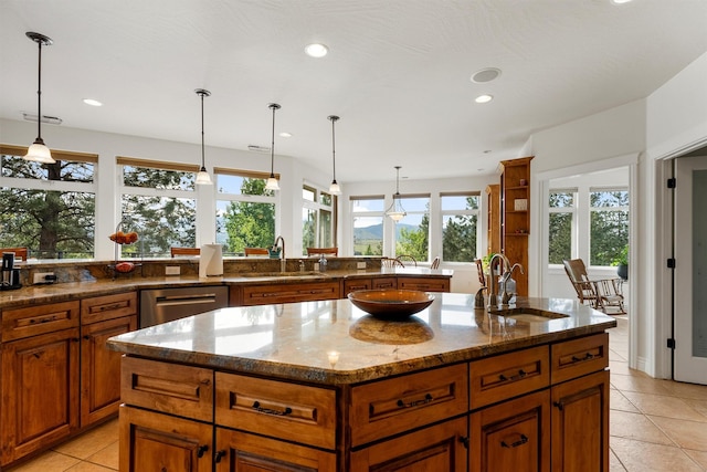 5959 Hayes Creek Rd, Missoula, MT 59804 - kitchen with a sink, dishwasher, an island with sink, light tile patterned flooring, and recessed lighting