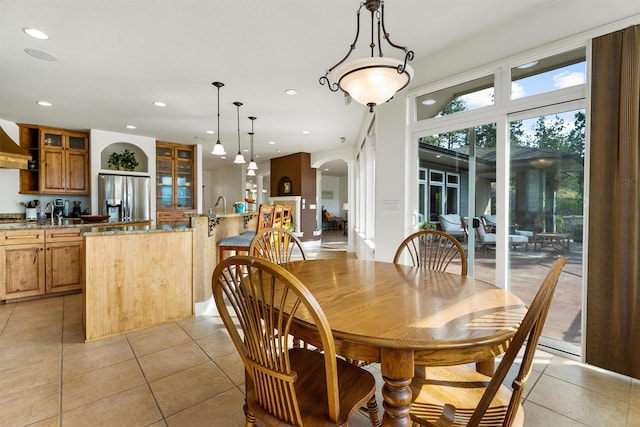 5959 Hayes Creek Rd, Missoula, MT 59804 - dining room with arched walkways, light tile patterned floors, and recessed lighting
