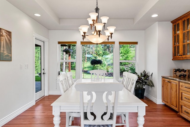 5959 Hayes Creek Rd, Missoula, MT 59804 - dining space featuring a chandelier, wood finished floors, baseboards, recessed lighting, and a raised ceiling