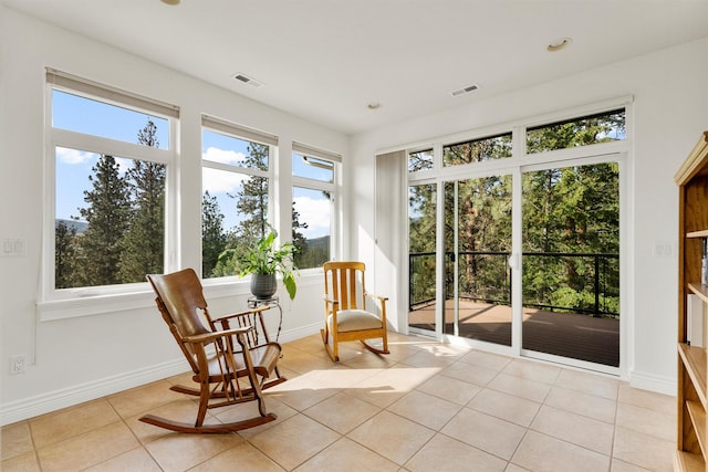 5959 Hayes Creek Rd, Missoula, MT 59804 - sunroom featuring tile patterned flooring and baseboards