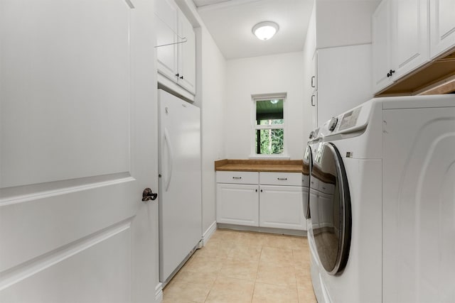 5959 Hayes Creek Rd, Missoula, MT 59804 - washroom featuring cabinet space, independent washer and dryer, and light tile patterned flooring
