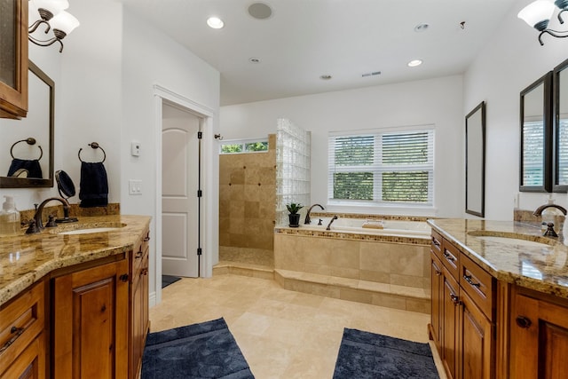 5959 Hayes Creek Rd, Missoula, MT 59804 - full bathroom with a bath, two vanities, walk in shower, recessed lighting, and tile patterned flooring