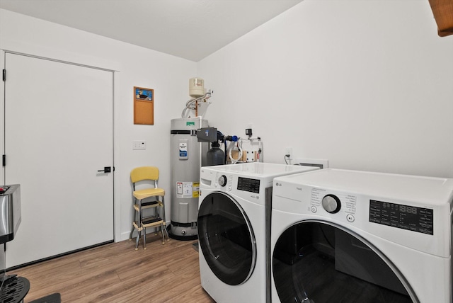 100 Bench Run, Columbia Falls, MT 59912 - laundry area with independent washer and dryer, electric water heater, and light wood-style floors