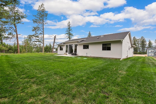 100 Bench Run, Columbia Falls, MT 59912 - back of property featuring a patio and a yard