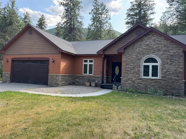 638 Trestle Creek Dr, Saint Regis, MT 59866 - craftsman inspired home featuring stone siding, asphalt driveway, an attached garage, and a front yard