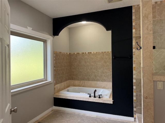 638 Trestle Creek Dr, Saint Regis, MT 59866 - bathroom with a garden tub and tile patterned flooring