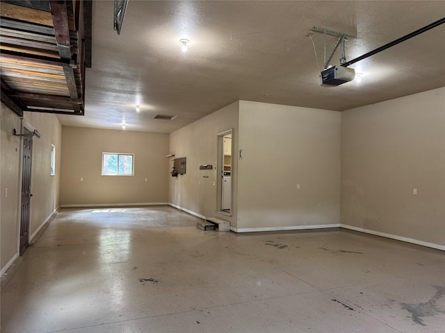 638 Trestle Creek Dr, Saint Regis, MT 59866 - garage featuring a garage door opener and baseboards