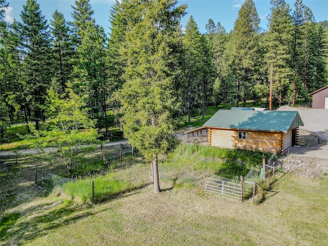 104 Swede Gulch Rd, Libby, MT 59923 - view of yard with an outbuilding and a wooded view