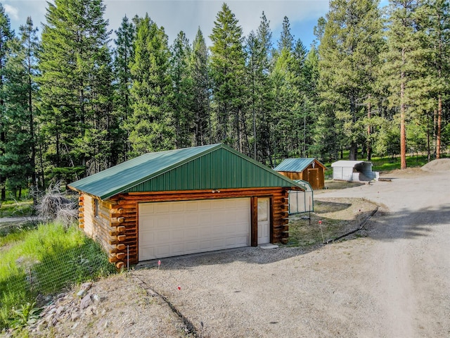 104 Swede Gulch Rd, Libby, MT 59923 - detached garage featuring a forest view