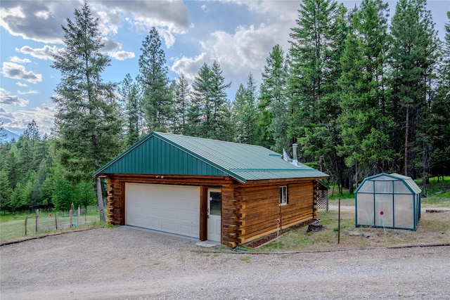 104 Swede Gulch Rd, Libby, MT 59923 - detached garage featuring a forest view