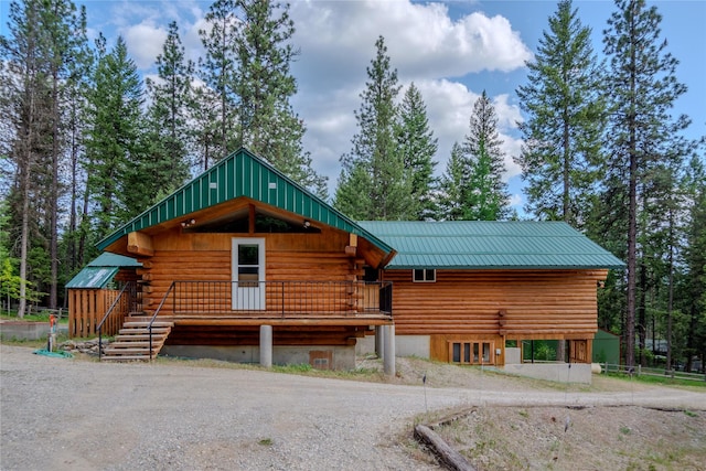 104 Swede Gulch Rd, Libby, MT 59923 - view of front facade with log exterior and metal roof