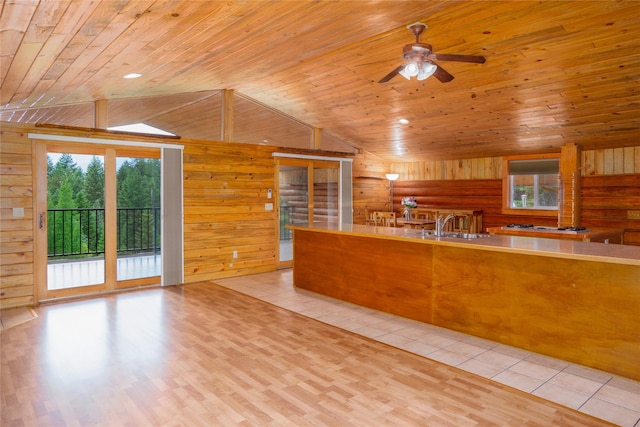 104 Swede Gulch Rd, Libby, MT 59923 - kitchen with lofted ceiling, wooden ceiling, plenty of natural light, wood walls, and a ceiling fan