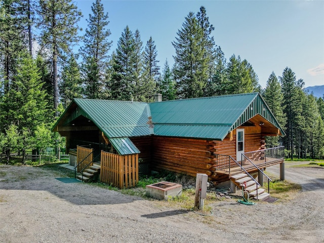 104 Swede Gulch Rd, Libby, MT 59923 - horse barn featuring a wooded view