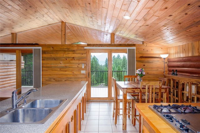 104 Swede Gulch Rd, Libby, MT 59923 - kitchen featuring a sink, wood ceiling, stainless steel gas stovetop, light tile patterned floors, and lofted ceiling