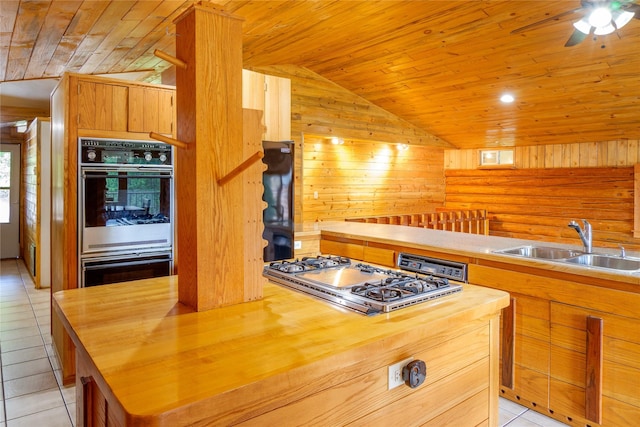 104 Swede Gulch Rd, Libby, MT 59923 - kitchen featuring wood ceiling, wooden counters, a sink, lofted ceiling, and multiple ovens