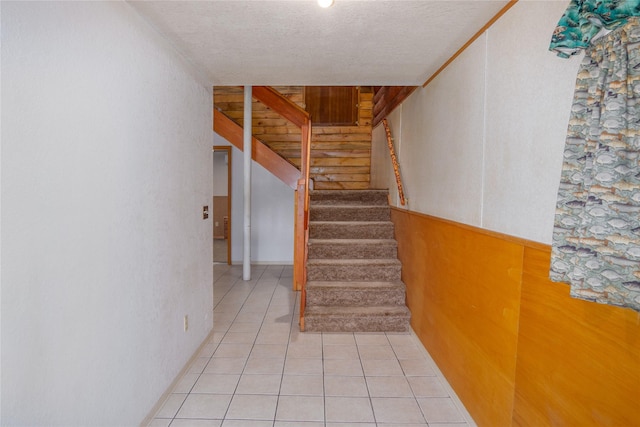 104 Swede Gulch Rd, Libby, MT 59923 - stairway featuring a textured ceiling and tile patterned floors