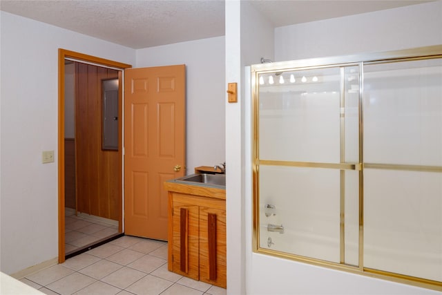 104 Swede Gulch Rd, Libby, MT 59923 - bathroom with a sink, shower / bath combination with glass door, tile patterned flooring, and electric panel