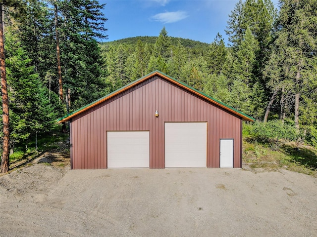 104 Swede Gulch Rd, Libby, MT 59923 - detached garage featuring a forest view