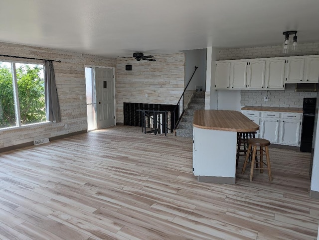 11 City Shop Rd, Shelby, MT 59474 - kitchen with a ceiling fan, white cabinets, butcher block countertops, and light wood-style floors