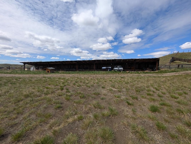 11 City Shop Rd, Shelby, MT 59474 - view of yard with a carport and an outbuilding