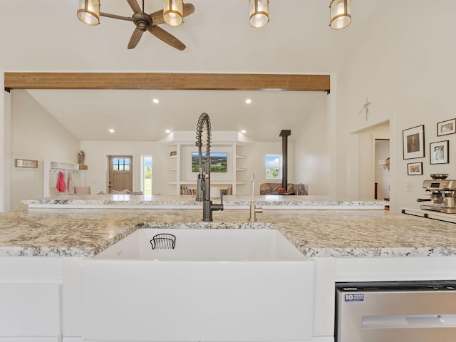 871 Conrad Dr, Kalispell, MT 59901 - kitchen with a sink, open floor plan, ceiling fan, dishwasher, and light stone counters