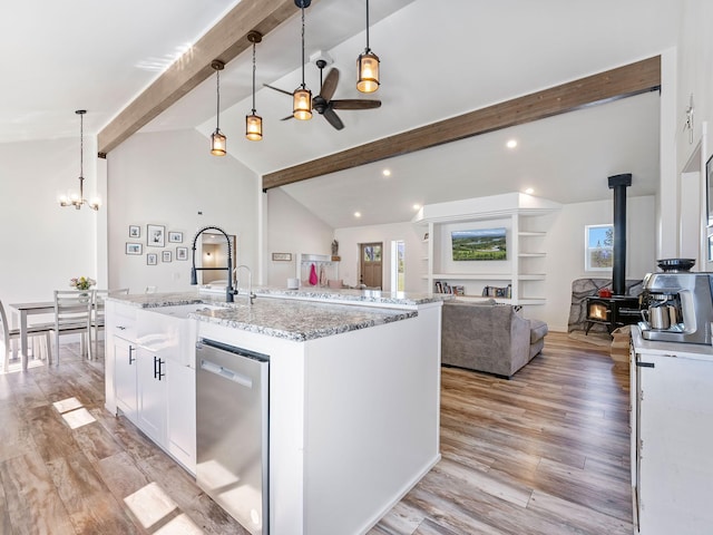 871 Conrad Dr, Kalispell, MT 59901 - kitchen featuring stainless steel dishwasher, a wood stove, white cabinetry, open floor plan, and recessed lighting