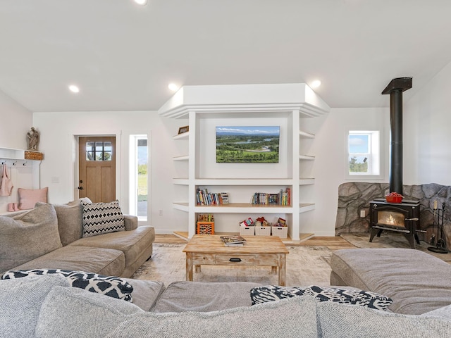 871 Conrad Dr, Kalispell, MT 59901 - living room with a wood stove, plenty of natural light, wood finished floors, and recessed lighting